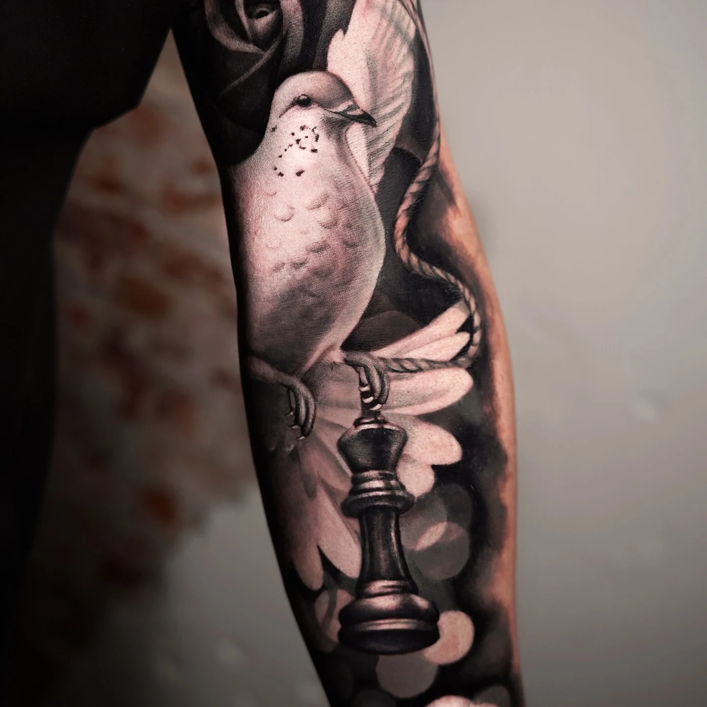 Detail of grey tones tattoo work by Ravi Brink.