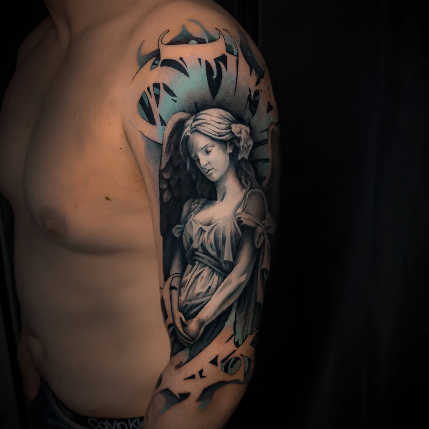 Detail of custom black & grey tattoo work by Ravi Brink.